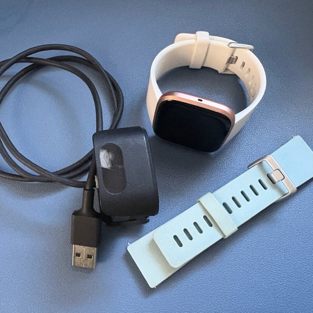 Fitbit Versa 2 Rose Gold includes charger and White and Blue Bands